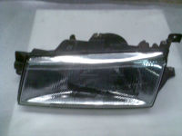 Hauptscheinwerfer links 011139 (101-0490) inkl. Stellmotor<br>HYUNDAI PONY/EXCEL STUFENHECK (X-2) 1.5 I